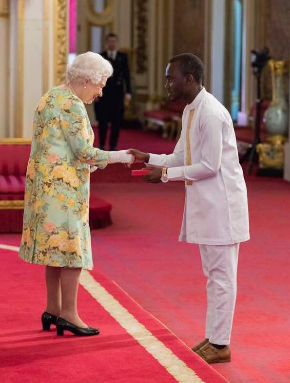 Derick Omari from Tech Era meeting the Queen